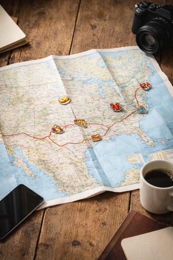 U.S. road trip map with a route line and food-themed pins